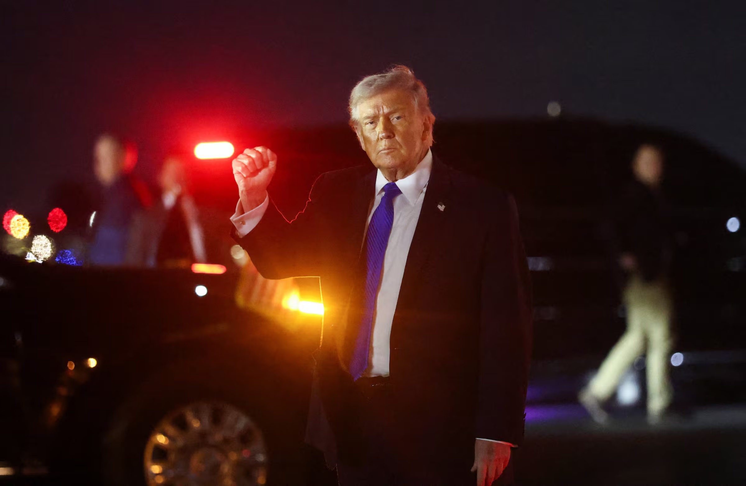U.S. President Donald Trump gestures after disembarking Air Force One at Palm Beach International Airport in West Palm Beach, Florida, U.S., March 13, 2026. REUTERS/Kevin Lamarque Purchase Licensing Rights